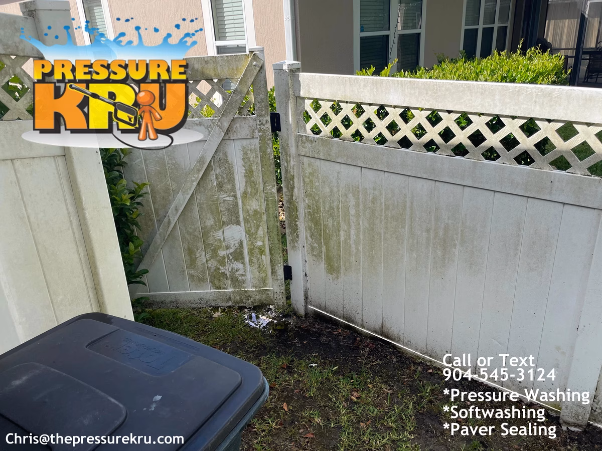 Residential vinyl fence cleaning in Oxford Estates before green mold removal