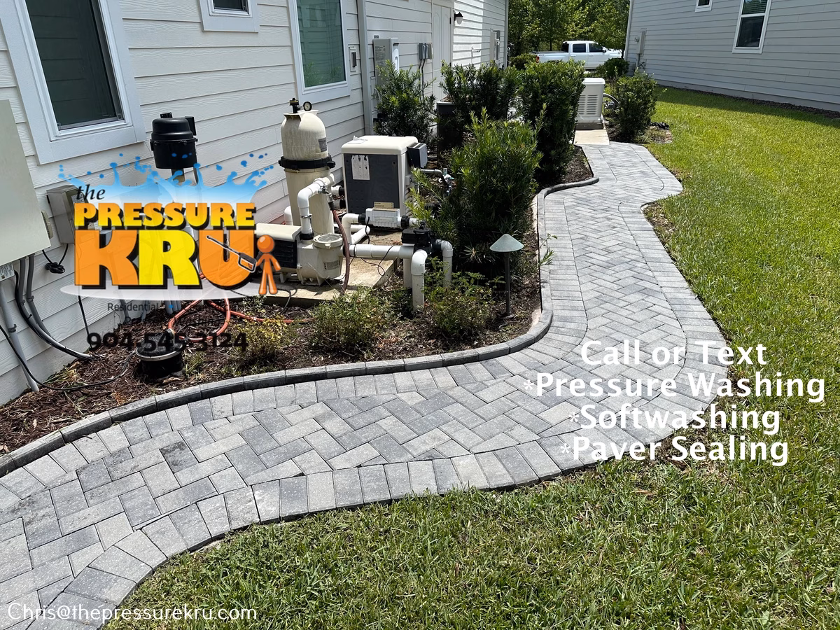 Professional paver driveway restoration after pressure washing in Greenbriar Plantation.