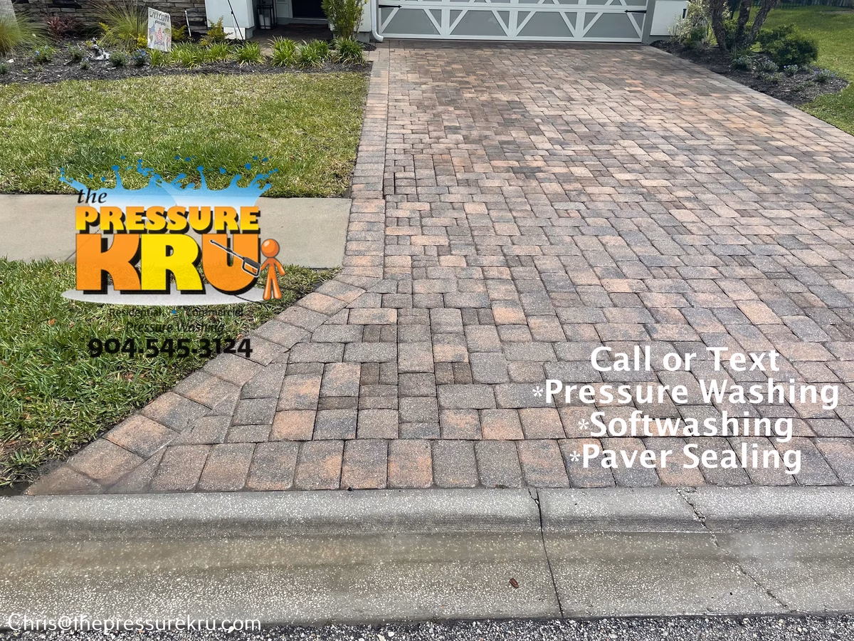 Oil stained paver driveway after pressure washing in Aberdeen.