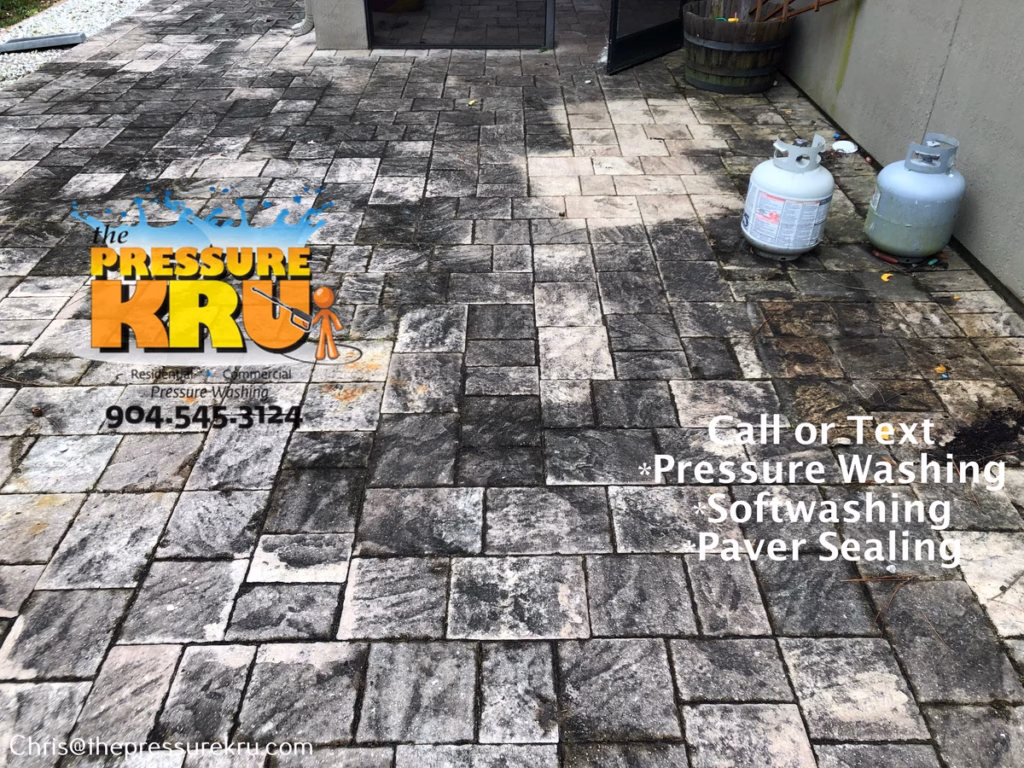 Pressure washing back yard paver patio in Cimarrone before.