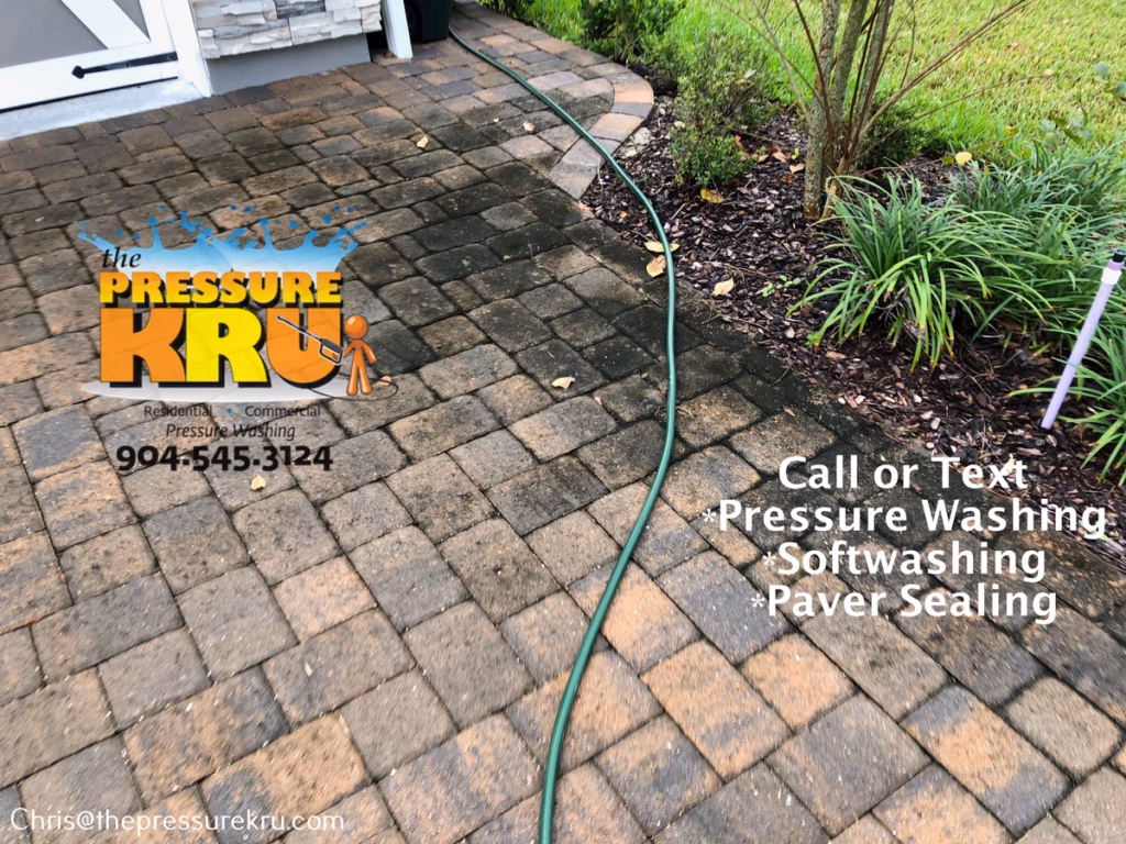 Clean restored paver driveway before professional pressure washing in Rivertown.