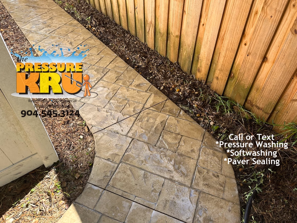 Soft wash stamped concrete sidewalk in Julington Creek Plantation after