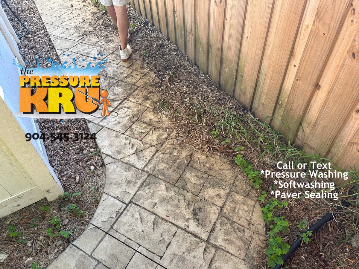 Soft wash stamped concrete sidewalk in Julington Creek Plantation before