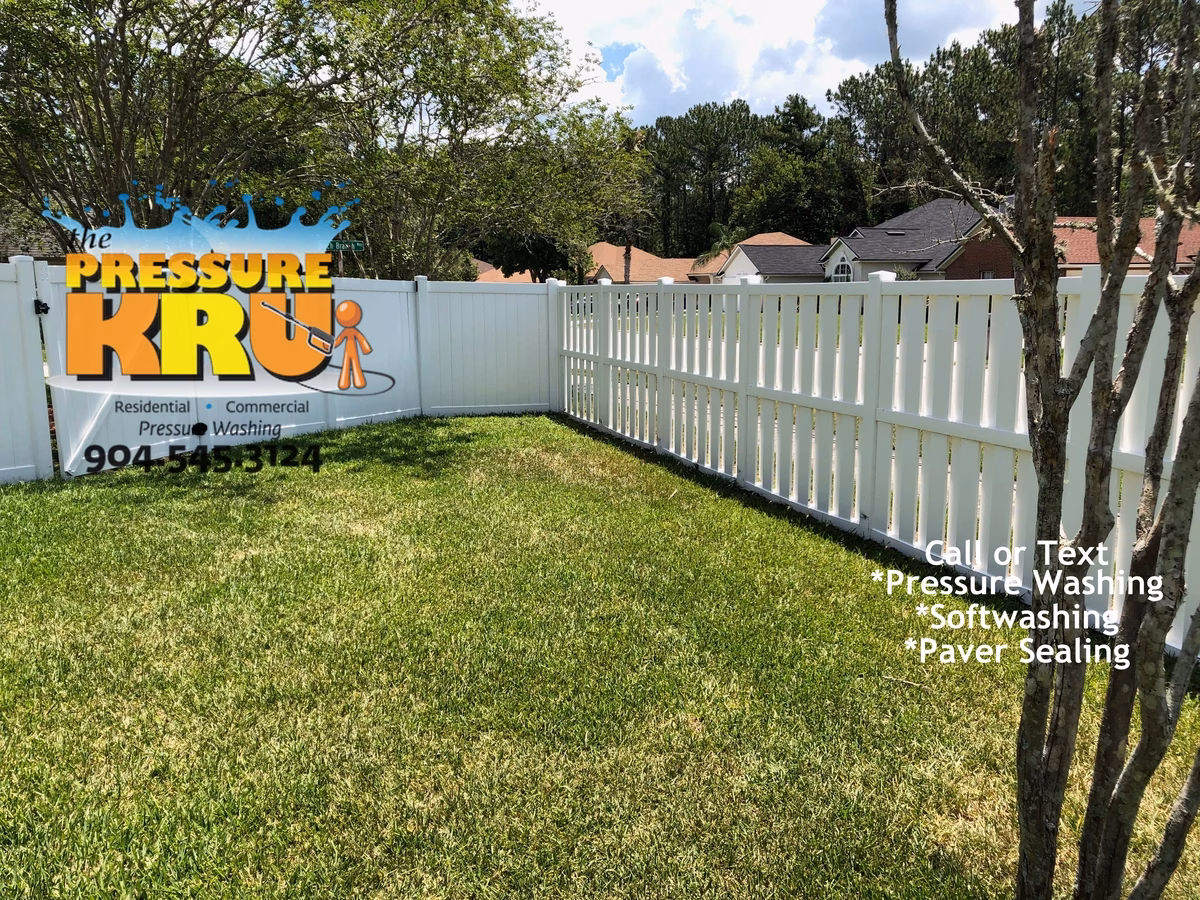 Fence Cleaning in Nocatee cleaning grime off a good neighbor style fence after