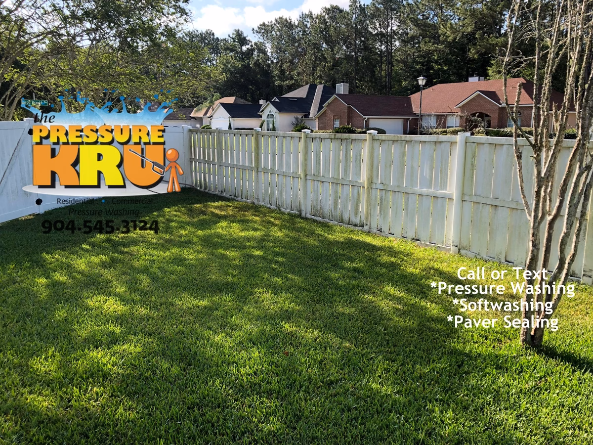 Fence Cleaning in Nocatee cleaning grime off a good neighbor style fence before