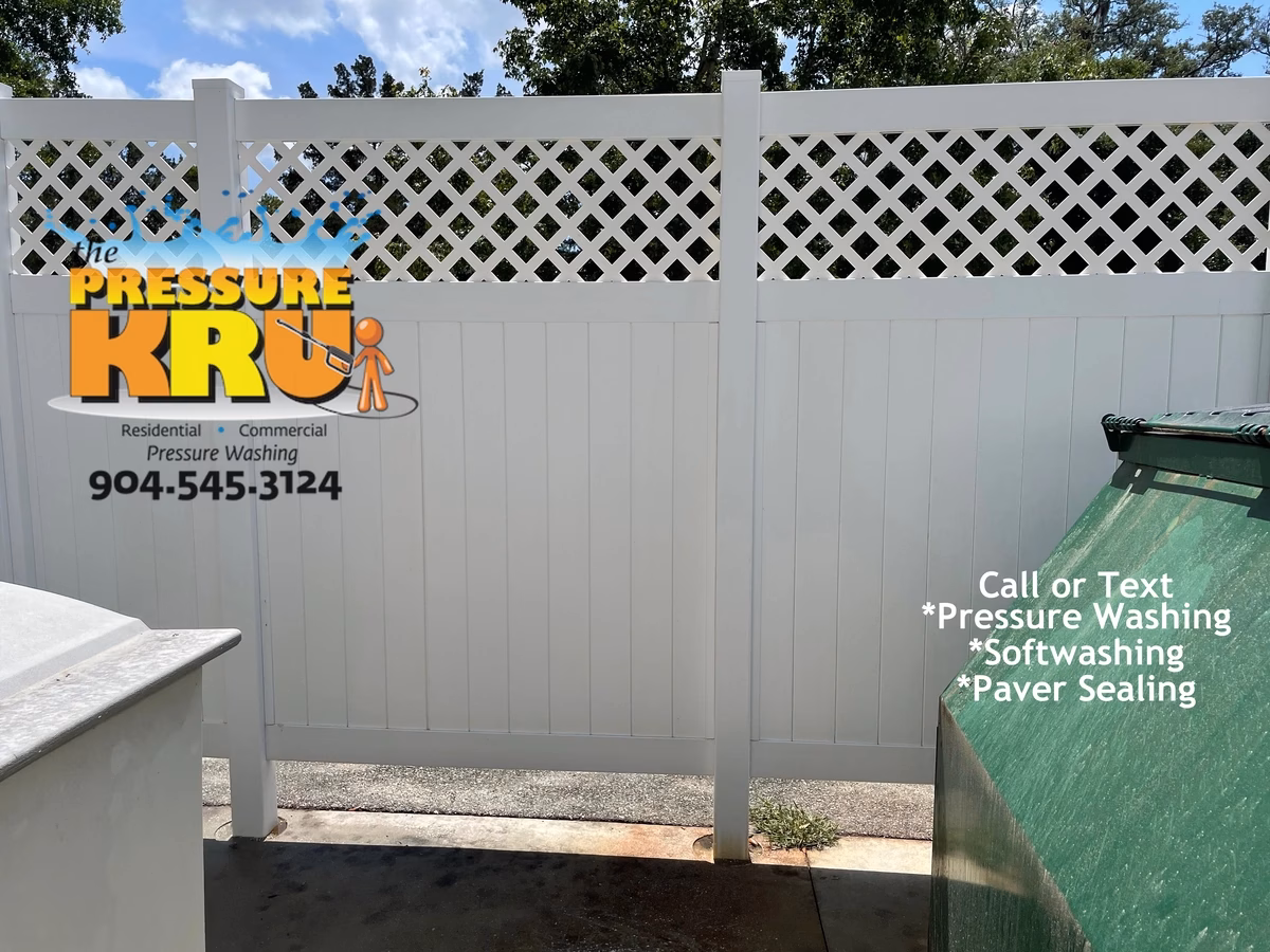Vinyl fence cleaning Fleming Island after mold and algae removal. This is also feces from vultures near a dumpster enclosure