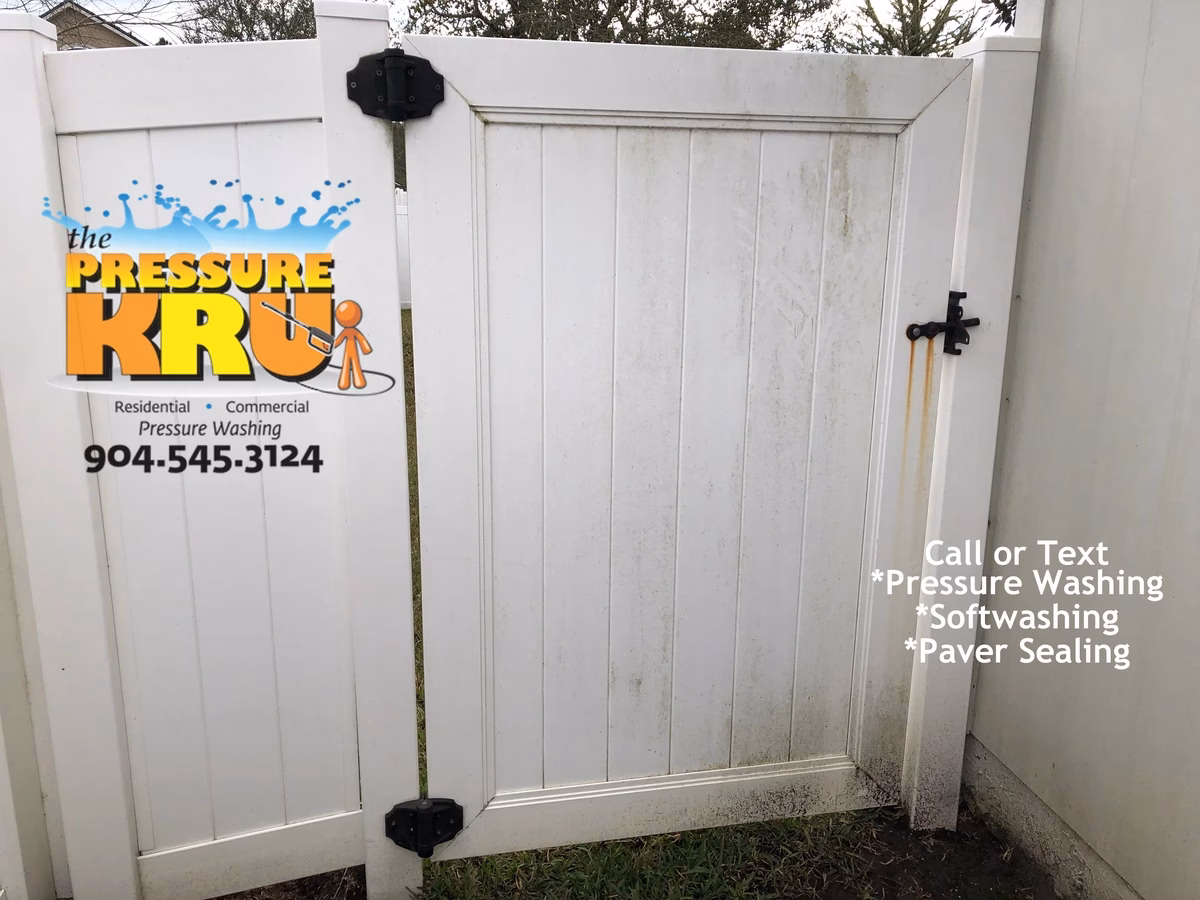 Vinyl fence cleaning service in Stonehurst showing annual grime build up before cleaning