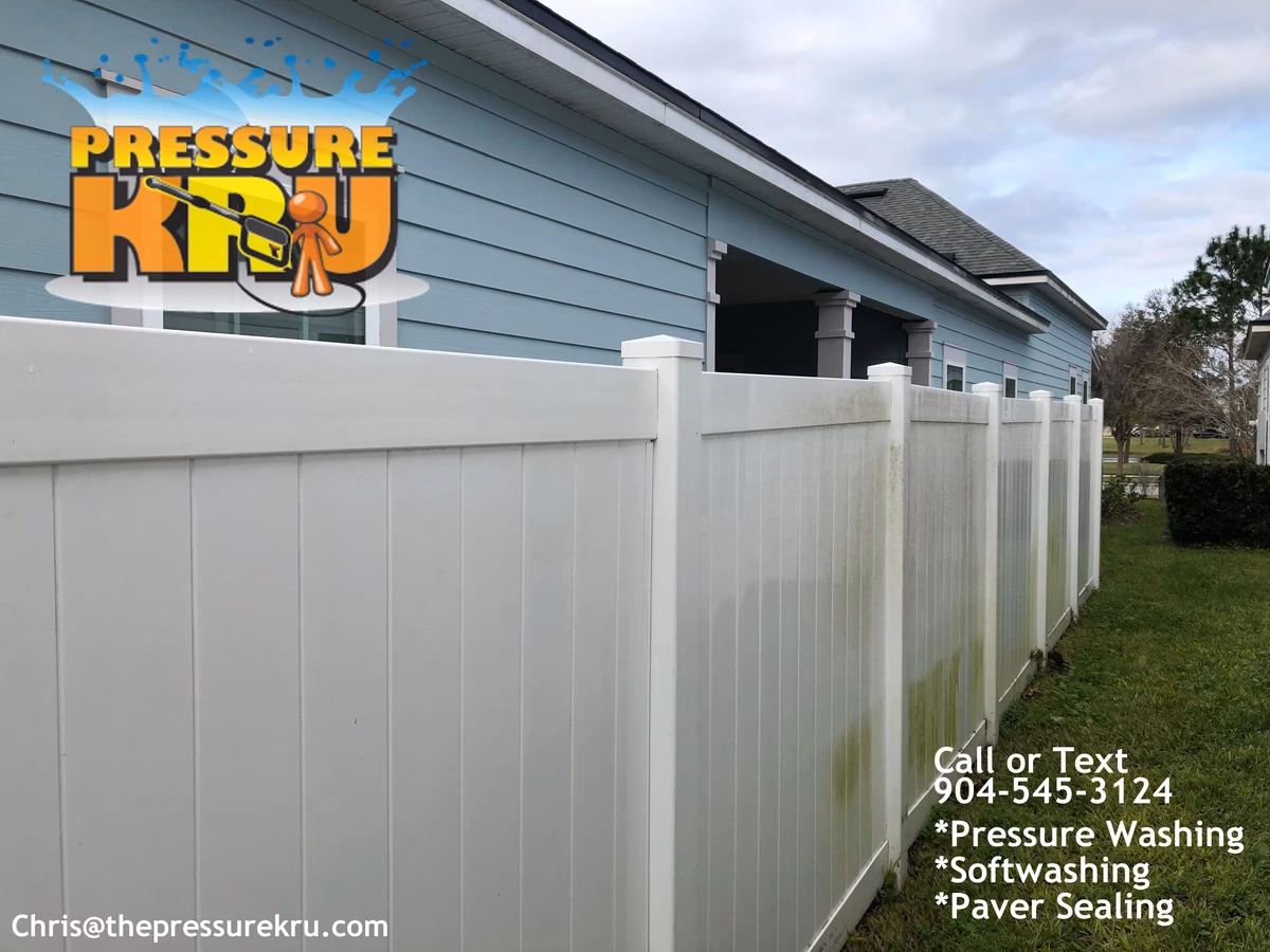 Fence cleaning in World Golf Village area showing green algae