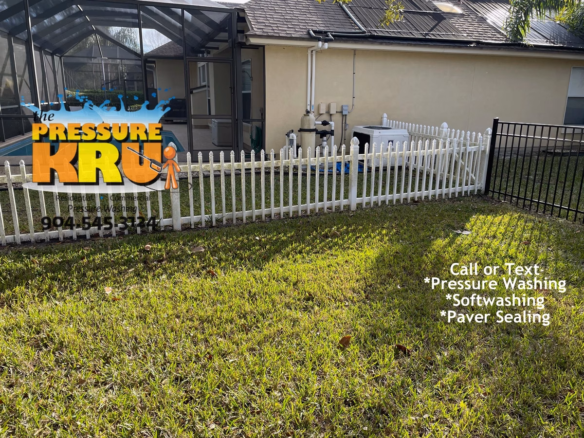 Vinyl fence cleaning service in Bartram Spring before green algae and mildew removal