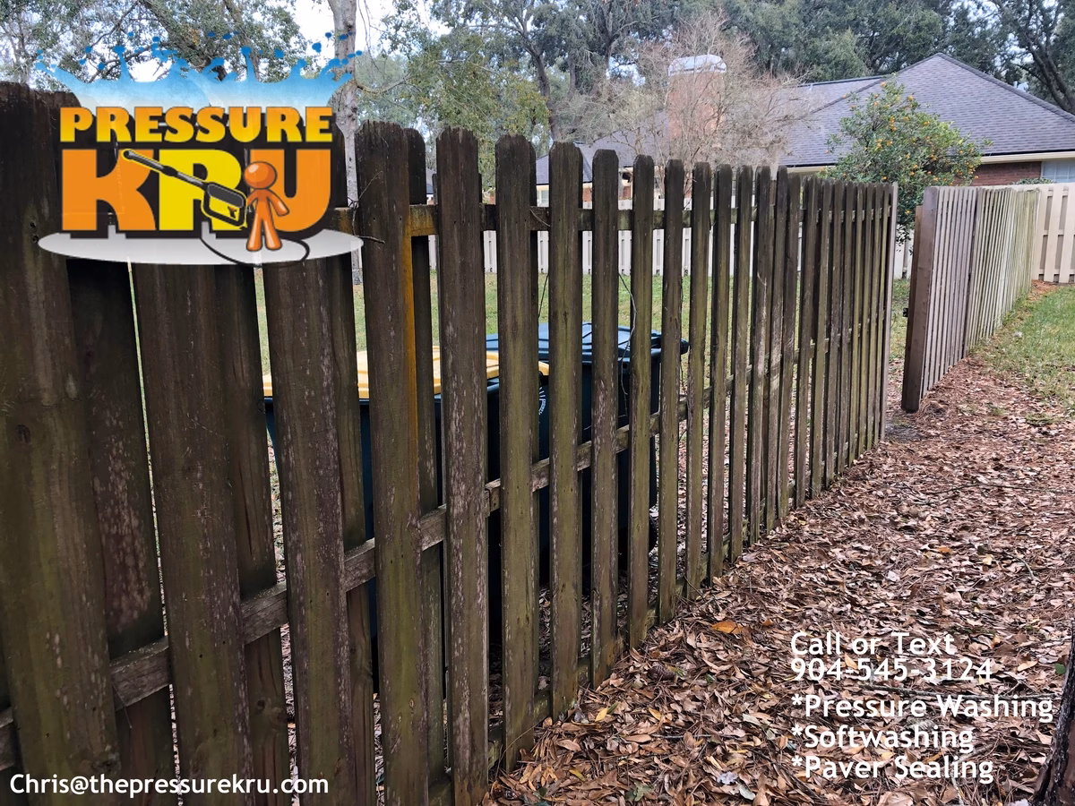 Wood fence before pressure washing in World Golf Village