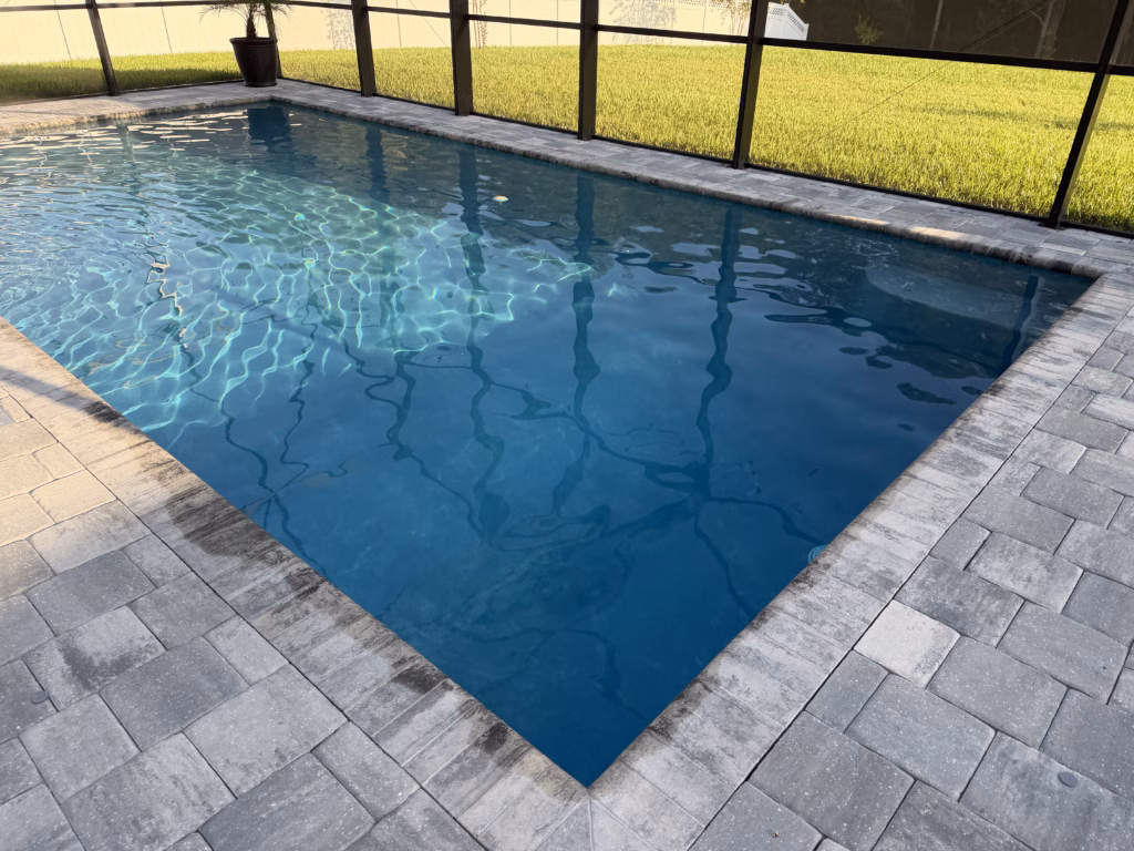 Image showing water level that is above the skimmer line. Pool water is directly in contact with coping keeping it saturated.