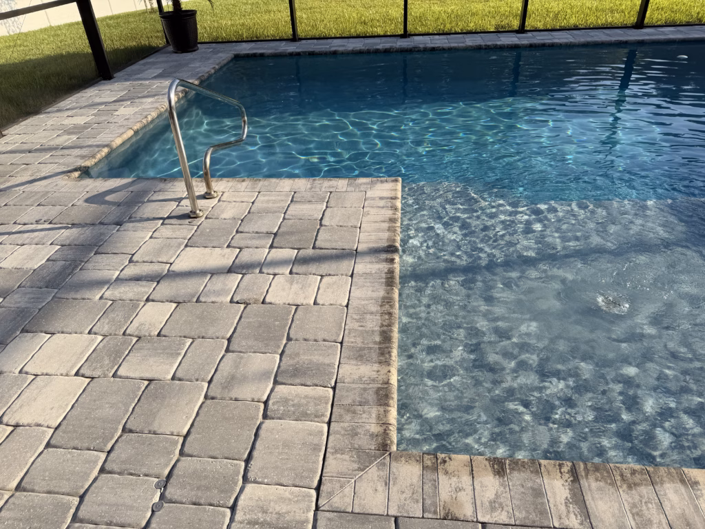 Image showing water level that is above the skimmer line. Pool water is directly in contact with coping keeping it saturated.